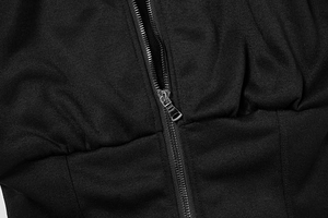 Detail of black knit sweatshirt featuring silver zipper and ruched waist design