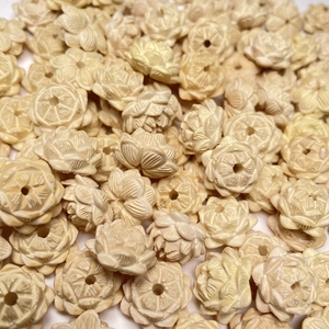 Handcrafted beige lotus flower wooden beads with intricate floral carving details