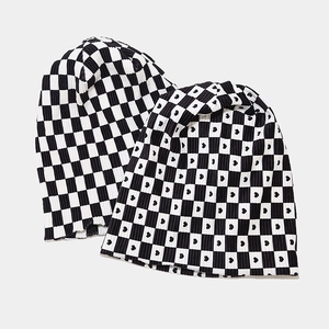 Checkerboard knit beanie set with heart patterns in classic black and white style