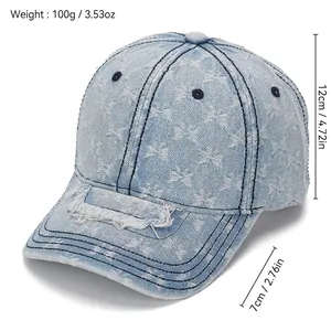 Distressed light blue denim baseball cap with butterfly pattern and frayed ripped details