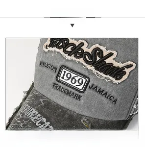 Close-up of vintage embroidery 1969 and Rock Shark on distressed baseball cap texture