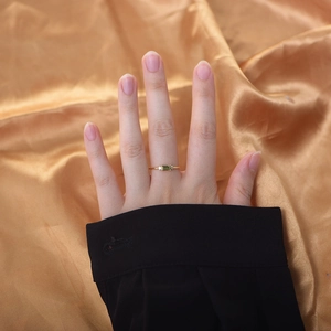 S925 silver gold ring featuring a rectangular green zircon and side stones on hand