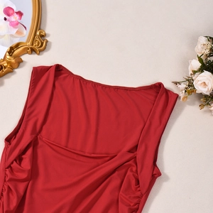 Detail of red square-neck top featuring ruched sides and high elasticity fabric