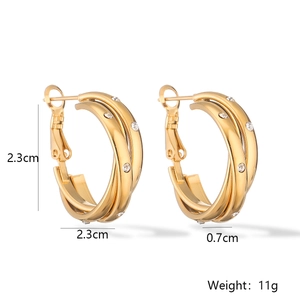 Detail showing 23mm 18K gold plated cross earrings with size and weight measurements