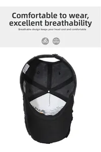 Detail view of the 100% cotton breathable inner lining and metal buckle of the black baseball cap