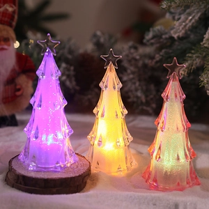 Detailed view of glowing acrylic mini Christmas tree LED night lights with glitter texture