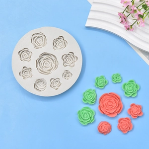 White silicone mold for 9 roses with finished green and coral pink flower models
