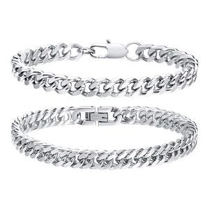 Detail view of silver Cuban link chains with lobster clasp and folding clasp closure