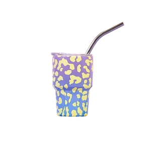 Detail view of a 3oz purple and blue gradient leopard print tumbler with straw