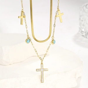Gold layered stainless steel necklace with turquoise beads and zircon cross charms