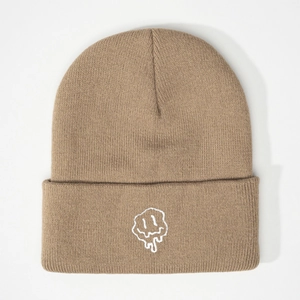 Khaki beanie featuring a white embroidered melting smiley face on a folded knit brim