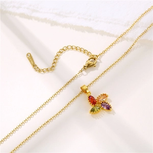 Golden stainless steel necklace featuring a colorful four-leaf flower zircon pendant