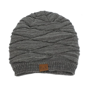 Close-up of dark grey knitted beanie with textured weave and brown leather brand label