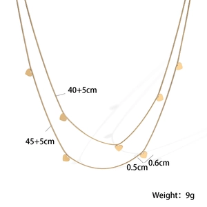Detailed view of 18K gold double-layer necklace with measurements and tiny heart charms