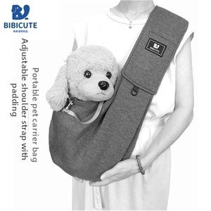 Detail of adjustable padded shoulder strap on the gray canvas pet carrier bag