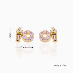 Detail shot of 18K gold plated donut earrings with pink and brown cubic zirconia stones