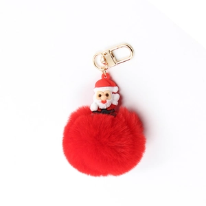 Silicone Santa Claus keychain with red faux fur pompom and golden metal ring