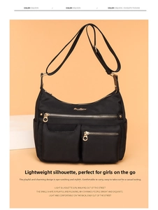 Detail view of black nylon crossbody bag with gold zippers and multiple front pockets