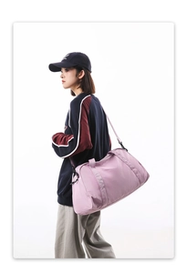 Close-up of a pink large-capacity lightweight gym and travel bag with strap