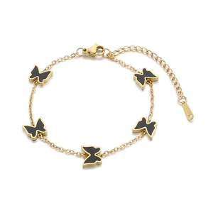 Elegant gold titanium steel bracelet featuring five black butterfly charms on a white background