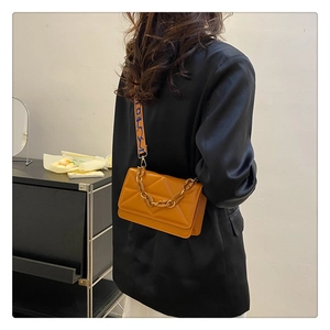 Caramel crossbody bag with quilted geometry and stylish woven wide shoulder strap