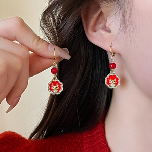 Elegant Red Dragon Year tassel earrings with gold dragon relief and white zircons