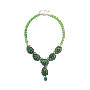 Vintage gold necklace featuring green crystal leaf pendants and matching beaded chain