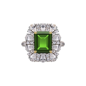 S925 silver ring with emerald-cut green stone and teardrop diamonds on white background