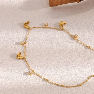 18K gold-plated butterfly anklet with zircon charms and beads on a minimalist chain