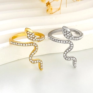 Fashionable gold and silver snake rings with zircon stones in a wave wrap design