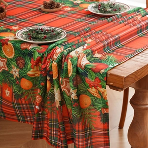 Christmas red and green plaid tablecloth featuring festive pine and ginger motifs