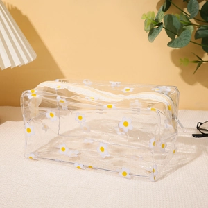 Trousse à cosmétiques en PVC transparent avec motif marguerites et fermeture beige
