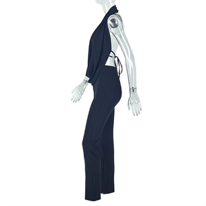 Detail of the backless halter neck design on a sleek black two-piece jumpsuit set