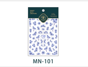 Detail of MN-101 blue floral nail stickers with 3D texture on green card packaging