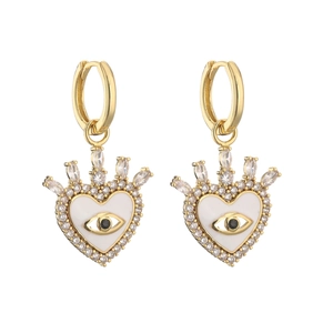 Detailed view of heart-shaped evil eye earrings with gold plating and cubic zirconia