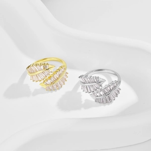 Close-up of gold and silver S925 sterling silver leaf rings with marquise zircon stones