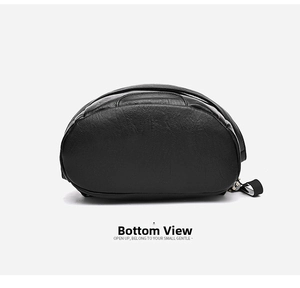 Detail view of the arched base and fine stitching on a black soft leather backpack