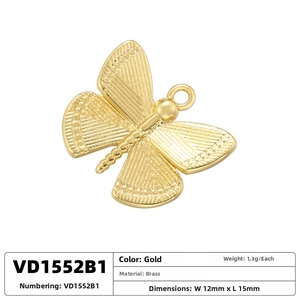 Macro detail of a 12x15mm gold brass butterfly pendant for DIY jewelry making