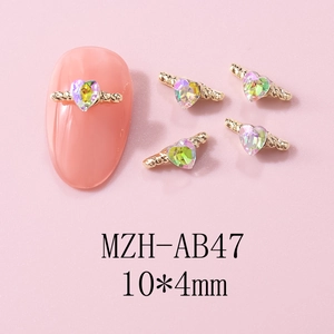 Macro view of 10x4mm iridescent heart nail charms with golden rope trim details