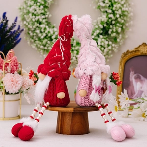 Detail of sequined hats and beaded long legs on plush Valentine gnomes for couple gifts
