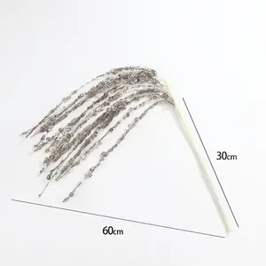 Close-up of 60cm sparkling champagne gold sequin Christmas spray with hanging tassels