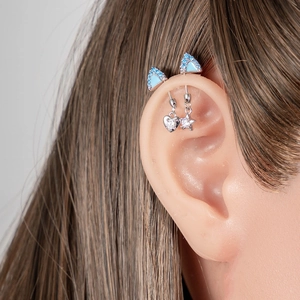 Titanium industrial barbell with blue gem triangle studs and heart star dangles