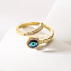 Bohemian 18K gold-plated Evil Eye open ring with zircons on a minimalist white stage