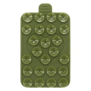 Olive green silicone phone suction mat with small cups and a unique heart-shaped pattern