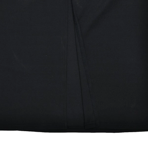 Close-up of black fabric texture with detailed stitching and hem for strapless dress