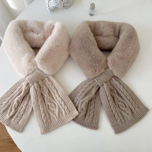 Detail of faux fur and cable knit stitching on beige and khaki winter scarves