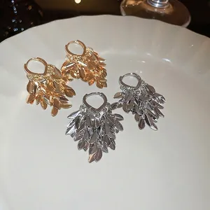 Elegant gold and silver leaf tassel earrings with multi-layered metallic fringe design