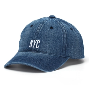 Close-up of NYC white embroidery on dark blue denim baseball cap with refined stitching