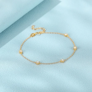 Detailed shot of golden S925 sterling silver bracelet with sparkling zircon stones