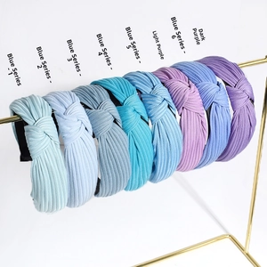 Set of 8 wide knotted headbands in blue and purple shades with ribbed knit texture